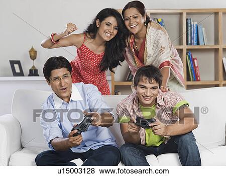 Family playing video game View Large Photo Image Stock Photo - Family playing video game. Fotosearch