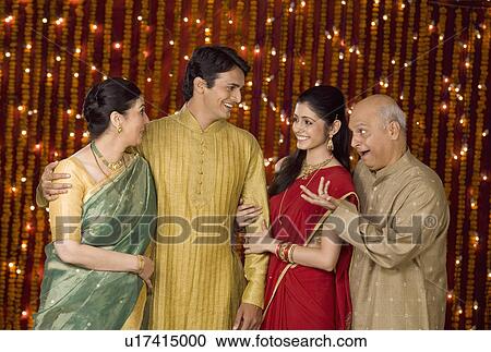 Stock Image - Family talking with one another. Fotosearch