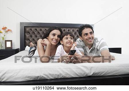 Picture - Family watching television. Fotosearch