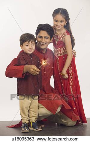 Father and children celebrating Diwali View Large Photo Image Stock Image - Father and children celebrating Diwali. Fotosearch
