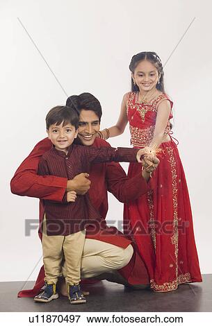 Father and children celebrating Diwali View Large Photo Image Stock Photo - Father and children celebrating Diwali. Fotosearch