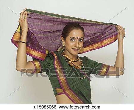 Female folk dancer dancing in traditional Maharashtrian dress View Large Photo Image Stock Photograph - Female folk dancer dancing in traditional Maharashtrian dress. Fotosearch