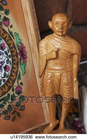 Stock Photograph - Figurine of Mahatma Gandhi at a market stall, New Delhi, India. Fotosearch