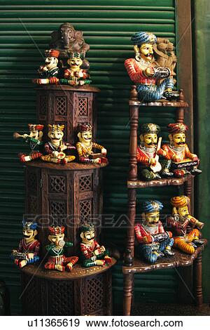 Figurines at a market stall, Delhi, India View Large Photo Image Stock Photo - Figurines at a market stall, Delhi, India. Fotosearch