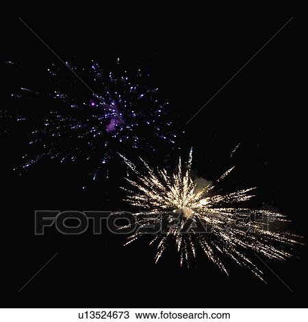 Stock Image - Fireworks display at night. Fotosearch