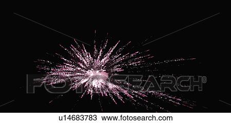 Stock Image - Fireworks display at night. Fotosearch
