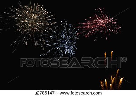 Stock Image - Fireworks display at night. Fotosearch