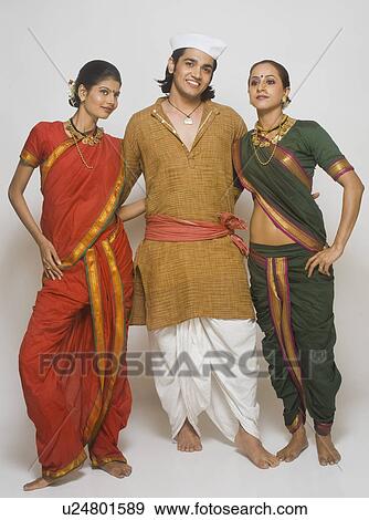 Folk dancer dancing together in traditional Maharashtrian dress View Large Photo Image Stock Photo - Folk dancer dancing together in traditional Maharashtrian dress. Fotosearch