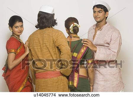 Picture - Folk dancers standing together in traditional Maharashtrian dress. Fotosearch