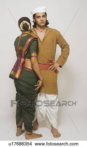 Folk dancers standing together in traditional Maharashtrian dress View Large Photo Image Picture - Folk dancers standing together in traditional Maharashtrian dress. Fotosearch