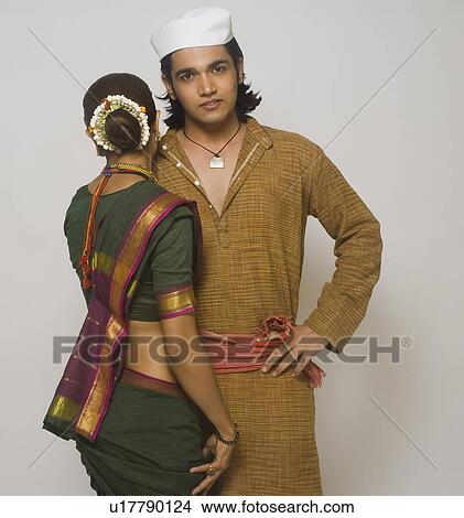 Folk dancers standing together in traditional Maharashtrian dress View Large Photo Image Picture - Folk dancers standing together in traditional Maharashtrian dress. Fotosearch