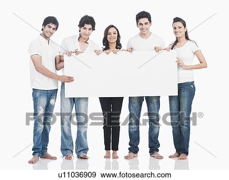Stock Photo - Friends holding a whiteboard and smiling. Fotosearch