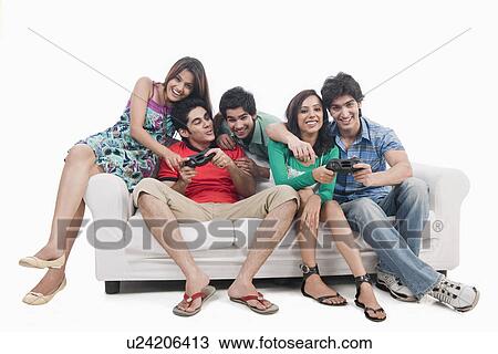 Friends playing video game View Large Photo Image Stock Image - Friends playing video game. Fotosearch