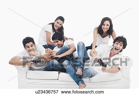 Friends playing video game View Large Photo Image Stock Photo - Friends playing video game. Fotosearch