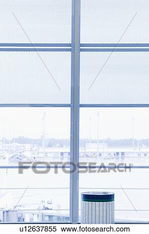 Stock Photography - Garbage bin at an airport lounge, Paris, France. Fotosearch