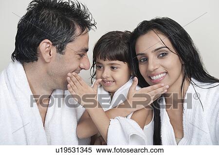 Girl smiling with her parents View Large Photo Image Stock Photography - Girl smiling with her parents. Fotosearch