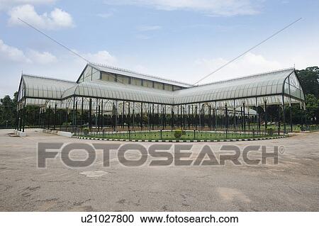 Stock Image - Glass house in a botanical garden, Lal Bagh Botanical Garden, Bangalore, Karnataka, India. Fotosearch