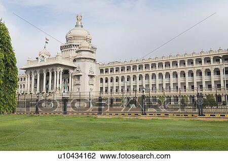 Stock Image - Government building viewed from a garden, Vidhana Soudha, Bangalore, Karnataka, India. Fotosearch