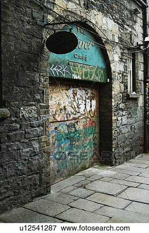 Stock Photo - Graffiti on a ruined cafe wall, Republic of Ireland. Fotosearch