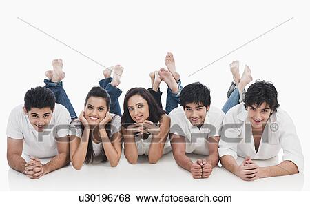 Group of friends lying on the floor View Large Photo Image Stock Photo - Group of friends lying on the floor. Fotosearch
