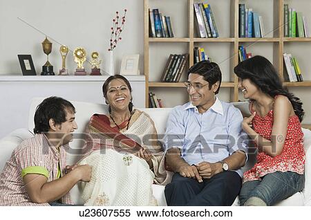 Stock Photography - Happy family in a living room. Fotosearch