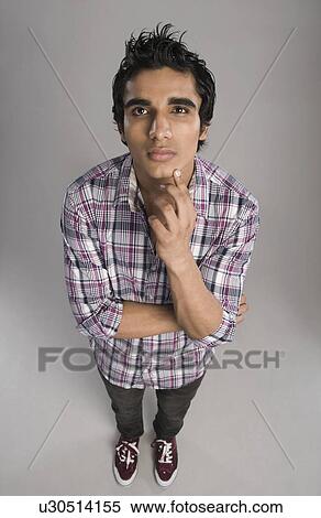 High angle view of a man in thoughtful mood View Large Photo Image Stock Photography - High angle view of a man in thoughtful mood. Fotosearch