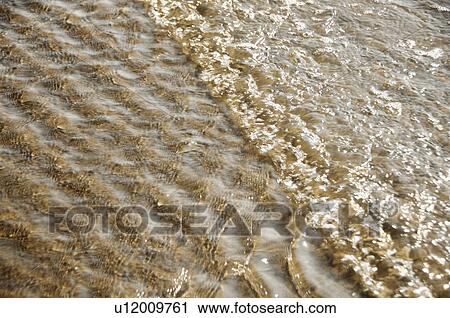Stock Image - High angle view of waves on the beach, Goa, India. Fotosearch