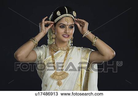 Stock Image - Indian woman in traditional clothing. Fotosearch