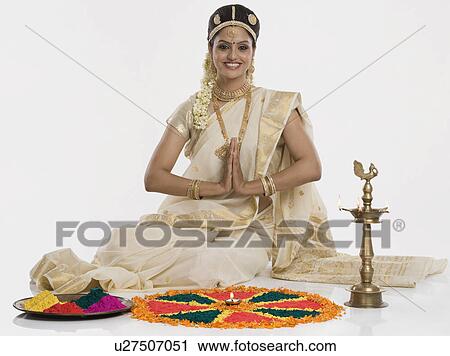 Indian woman in traditional clothing praying at Durga puja festival View Large Photo Image Stock Image - Indian woman in traditional clothing praying at Durga puja festival. Fotosearch