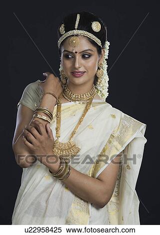 Indian woman in traditional clothing View Large Photo Image Stock Photography - Indian woman in traditional clothing. Fotosearch