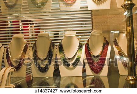 Jewelry on display in a jewelry store, New Delhi, India View Large Photo Image Stock Photo - Jewelry on display in a jewelry store, New Delhi, India. Fotosearch