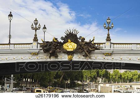 Stock Photograph - Lampposts on a bridge, Pont Alexandre III, Seine River, Paris, France. Fotosearch