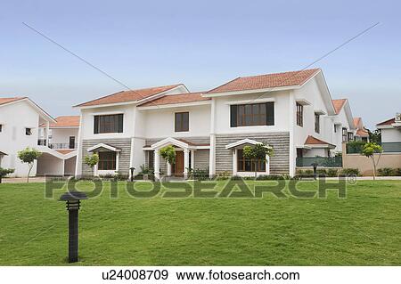 Stock Photo - Lawn in front of bungalows, Bangalore, Karnataka, India. Fotosearch
