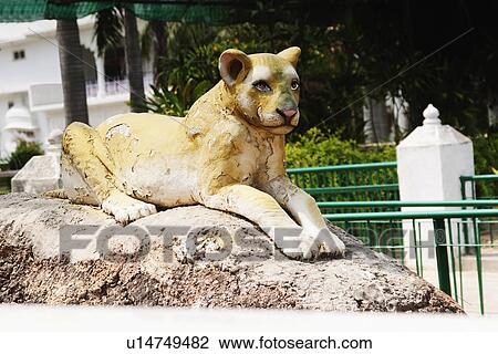 Lion statue at a park, Chhatarpur Temple, New Delhi, India View Large Photo Image Stock Image - Lion statue at a park, Chhatarpur Temple, New Delhi, India. Fotosearch
