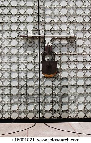 Stock Image - Lock hanging on a temple door, Chhatarpur Temple, New Delhi, India. Fotosearch