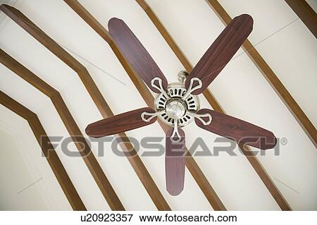 Stock Photo - Low angle view of a ceiling fan, Bangalore, Karnataka, India. Fotosearch