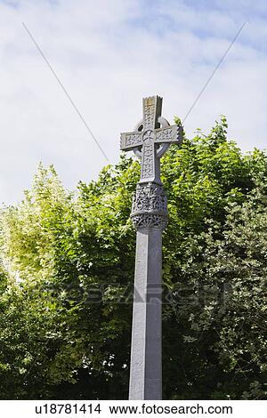 Picture - Low angle view of a Celtic cross in a church, Adare, County Limerick, Republic of Ireland. Fotosearch