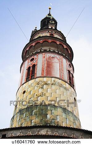 Stock Image - Low angle view of a clock tower in a castle, Cesky Krumlov Castle, Cesky Krumlov, South Bohemian Region, Czech Republic. Fotosearch