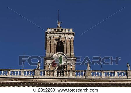 Stock Image - Low angle view of a clock tower, Rome, Lazio, Italy. Fotosearch