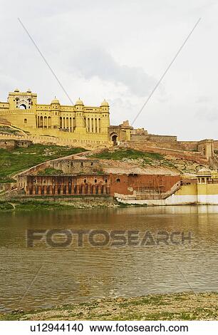 Stock Image - Low angle view of a fort, Maotha lake, Amber, Amber Fort, Jaipur, Rajasthan, India. Fotosearch