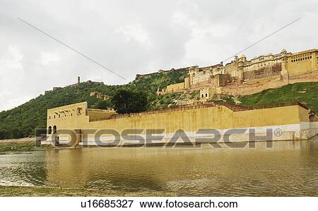 Stock Photo - Low angle view of a fort, Maotha lake, Amber, Amber Fort, Jaipur, Rajasthan, India. Fotosearch