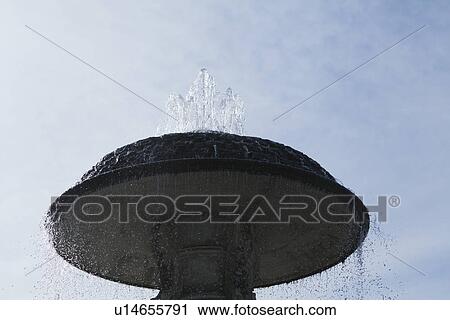 Stock Image - Low angle view of a fountain at St. Peters Square, Vatican City. Fotosearch