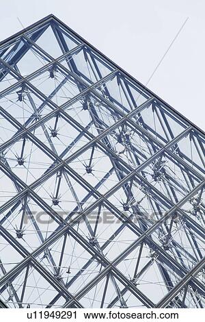 Stock Image - Low angle view of a pyramid, Louvre Pyramid, Musee du Louvre, Paris, France. Fotosearch