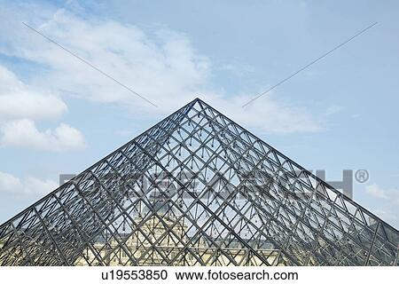 Stock Image - Low angle view of a pyramid, Louvre Pyramid, Musee du Louvre, Paris, France. Fotosearch