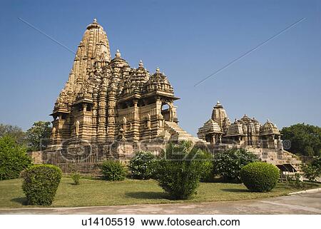 Low angle view of a temple, Kandariya Mahadeva Temple, Khajuraho, Chhatarpur District, Madhya Pradesh, India View Large Photo Image Stock Photo - Low angle view of a temple, Kandariya Mahadeva Temple, Khajuraho, Chhatarpur District, Madhya Pradesh, India. Fotosearch