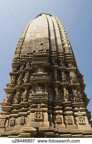 Stock Photo - Low angle view of a temple, Kandariya Mahadeva Temple, Khajuraho, Chhatarpur District, Madhya Pradesh, India. Fotosearch