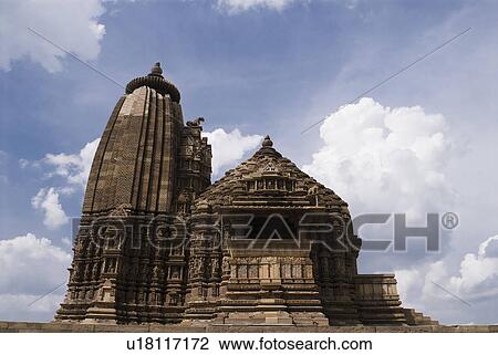 Low angle view of a temple, Lakshmana Temple, Khajuraho, Chhatarpur District, Madhya Pradesh, India View Large Photo Image Stock Image - Low angle view of a temple, Lakshmana Temple, Khajuraho, Chhatarpur District, Madhya Pradesh, India. Fotosearch