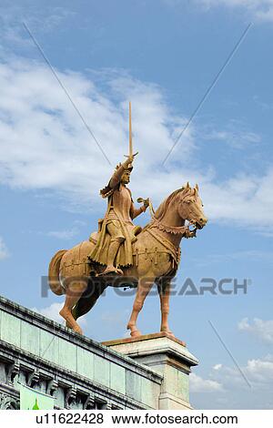 Stock Photo - Low angle view of an equestrian statue at a church, Basilique Du Sacre Coeur, Paris, France. Fotosearch