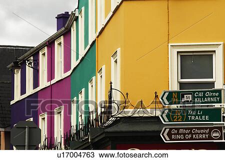 Low angle view of directional signs with buildings, Kenmare, County Kerry, Republic of Ireland View Large Photo Image Stock Image - Low angle view of directional signs with buildings, Kenmare, County Kerry, Republic of Ireland. Fotosearch