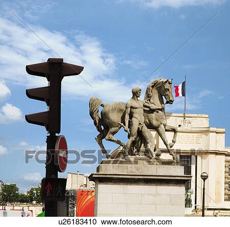 Low angle view of statues of a man with a horse, Paris, France View Large Photo Image Stock Image - Low angle view of statues of a man with a horse, Paris, France. Fotosearch